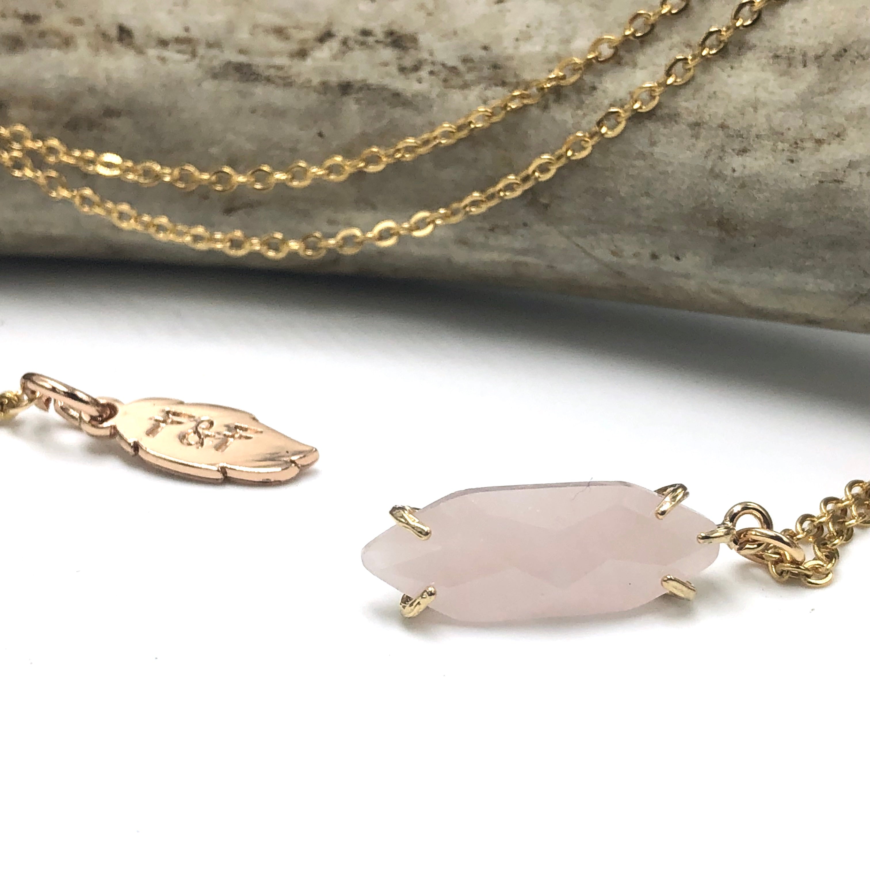 Facetted gold stone crystal necklace comes in amethyst, rose quartz, amazonite, and pure quartz. 