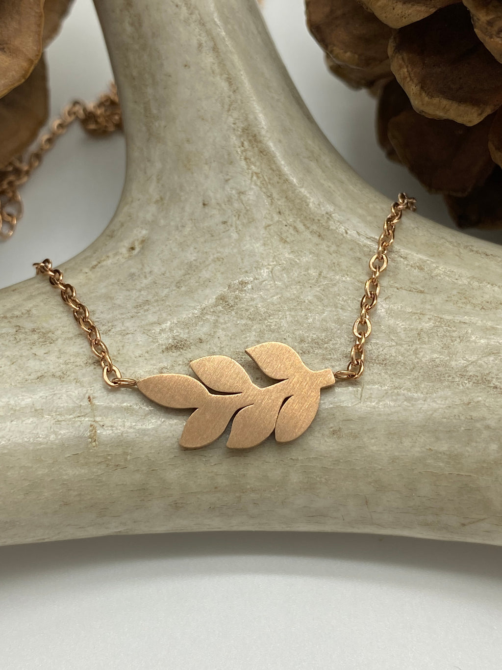 Adjustable waterproof mini leaf  necklace available in gold, silver and rose gold. 