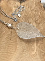 Load image into Gallery viewer, Long leaf necklace made with a real electroplated leaf. Available in Gold, Silver and Rose gold.
