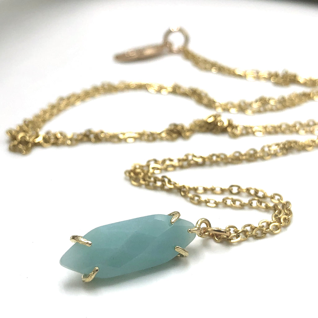 Facetted gold stone crystal necklace comes in amethyst, rose quartz, amazonite, and pure quartz. 